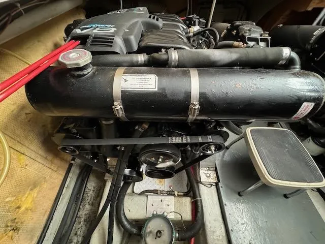 Slide: The Image of Engine compartment of 1974 Tollycraft 40 Tri-Cabin boat, showcasing mechanical components. - 45