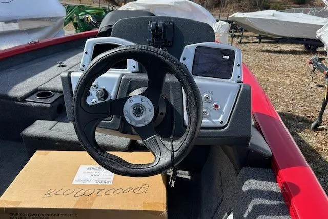 Slide: The Image of Steering console of 2025 Tracker Pro Team 175 Crappie Edition boat, featuring modern controls. - 92