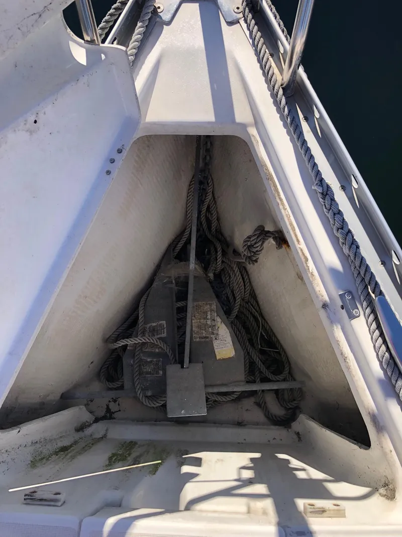 Slide: The Image of Anchor locker of 2004 Beneteau 331 sailboat with ropes and anchor chain. - 18