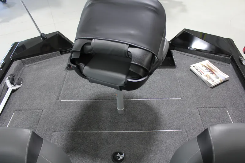 Slide: The Image of 2025 Tracker Pro Team 175 boat interior with swivel seat and carpeted deck. - 15