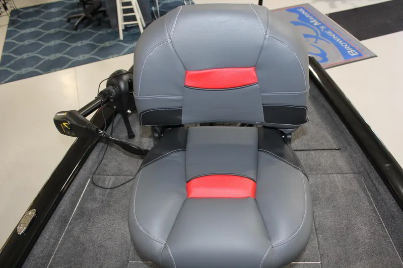 Slide: The Image of 2025 Tracker Pro Team 175 boat seat with gray and red upholstery. - 5