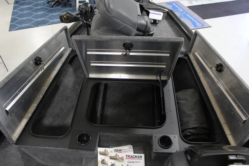 Slide: The Image of 2025 Tracker Pro Team 175 boat interior with open storage compartments and seating. - 7