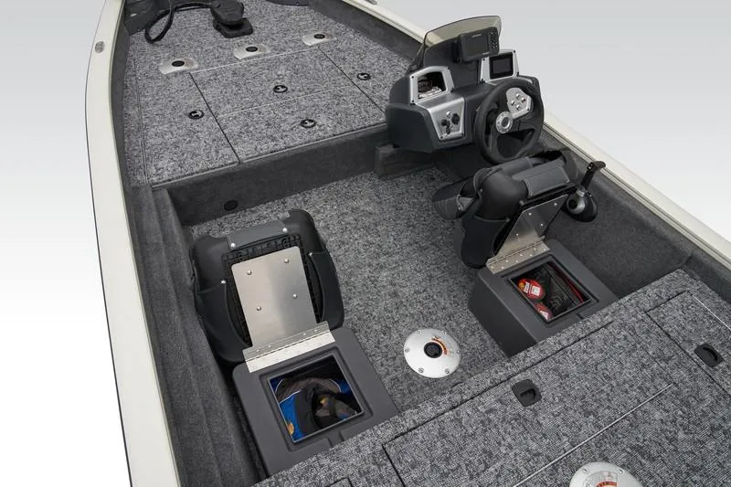 Slide: The Image of 2025 Tracker Pro Team 175 boat interior with storage compartments and steering console. - 16