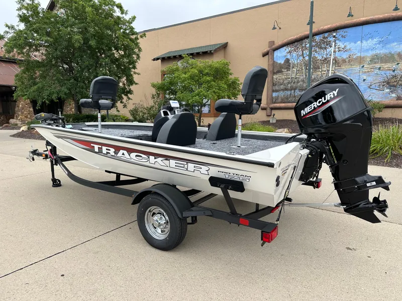Slide: The Image of 2025 Tracker Pro Team 175 boat with Mercury engine on trailer. - 2