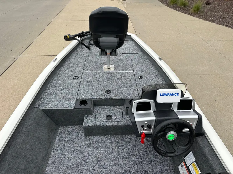 Slide: The Image of 2025 Tracker Pro Team 175 boat interior with Lowrance electronics and steering wheel. - 4