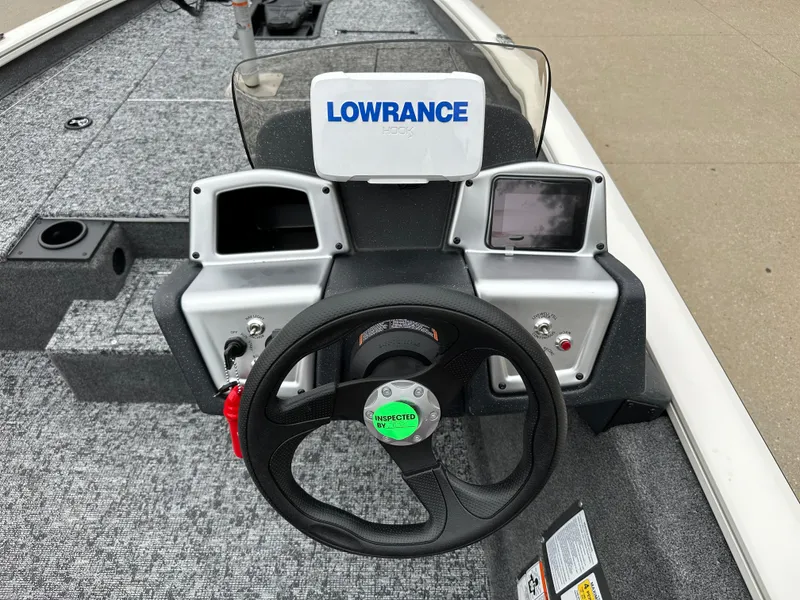 Slide: The Image of 2025 Tracker Pro Team 175 boat dashboard with Lowrance electronics and steering wheel. - 5