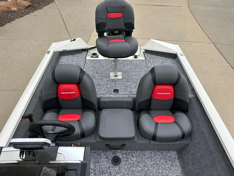Slide: The Image of 2025 Tracker Pro Team 175 boat interior with gray and red seating. - 6