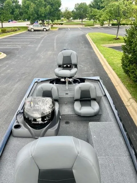 Slide: The Image of 2025 Tracker Pro 170 boat with gray seating in a parking lot. - 4