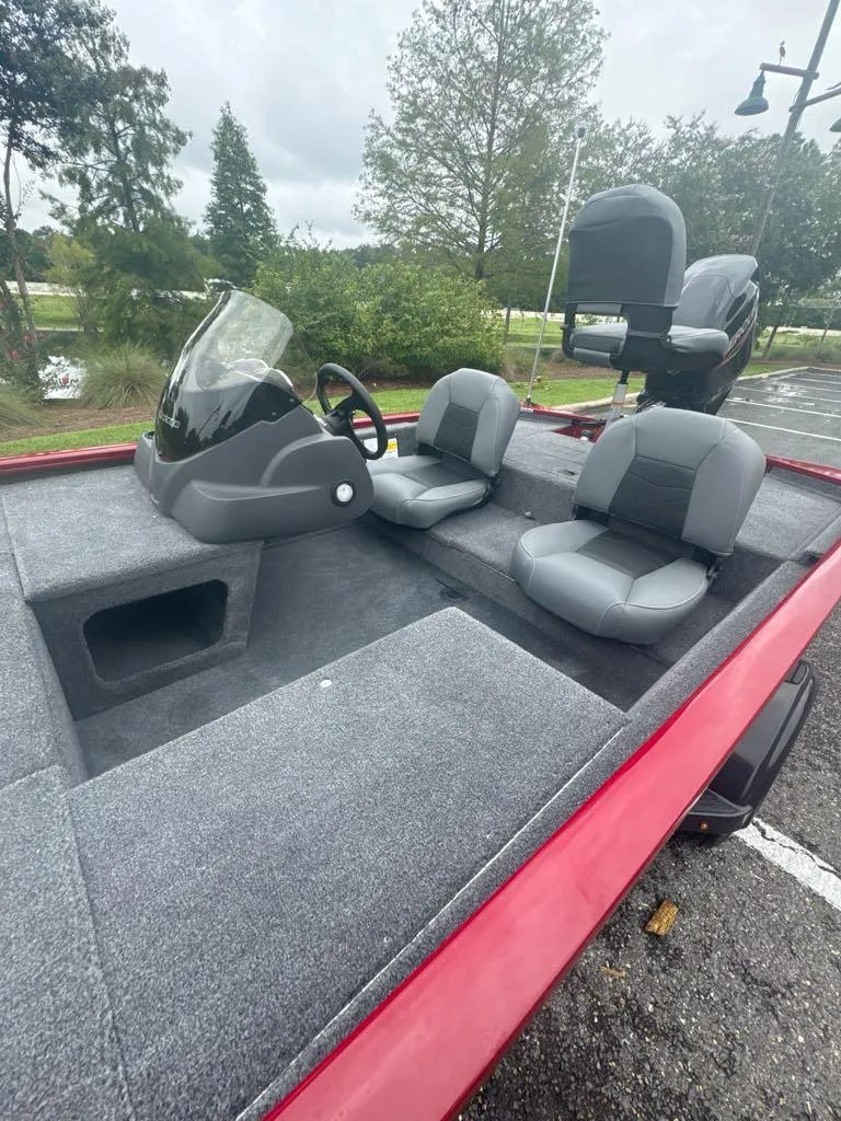 Slide: The Image of 2025 Tracker Pro 170 boat interior with gray seating and steering console. - 5