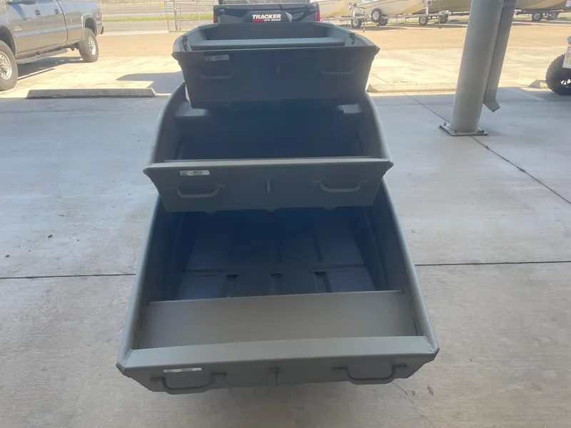 Slide: The Image of 2025 Tracker Grizzly 1236 Utility boat on display in outdoor setting. - 3