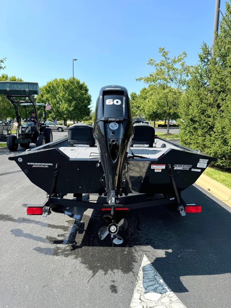Slide: The Image of 2025 Tracker Pro Team 175 Crappie Edition boat, rear view, parked outdoors. - 5