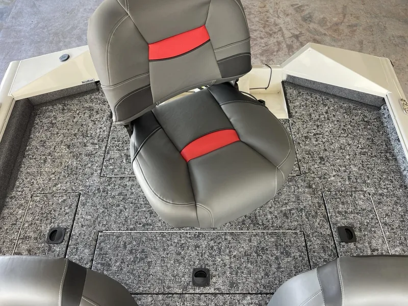 Slide: The Image of 2025 Tracker Pro Team 175 boat interior with gray and red seating. - 10