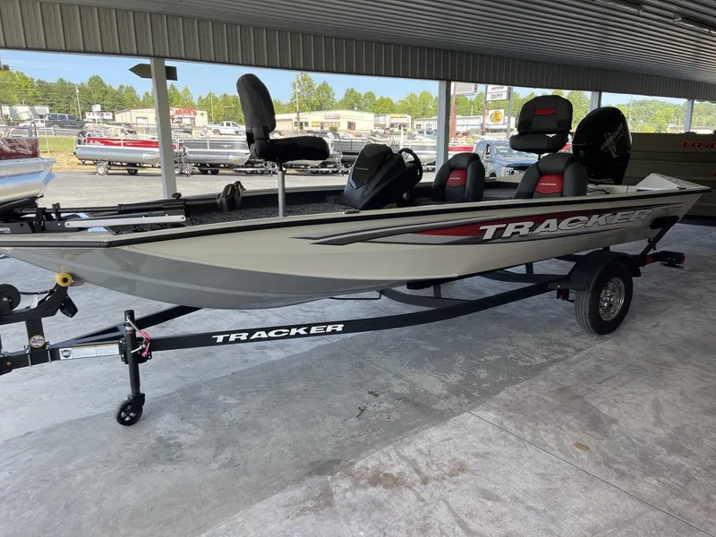 Slide: The Image of 2025 Tracker Pro Team 175 fishing boat on trailer in showroom. - 2