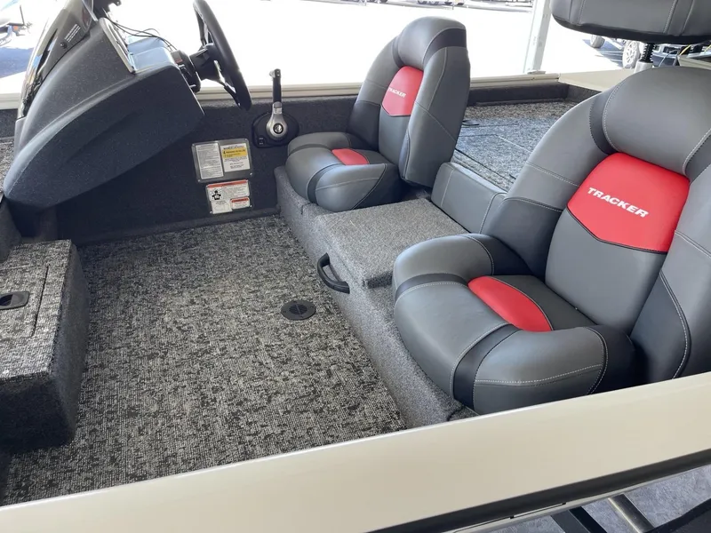 Slide: The Image of 2025 Tracker Pro Team 175 boat interior with gray and red seating. - 5