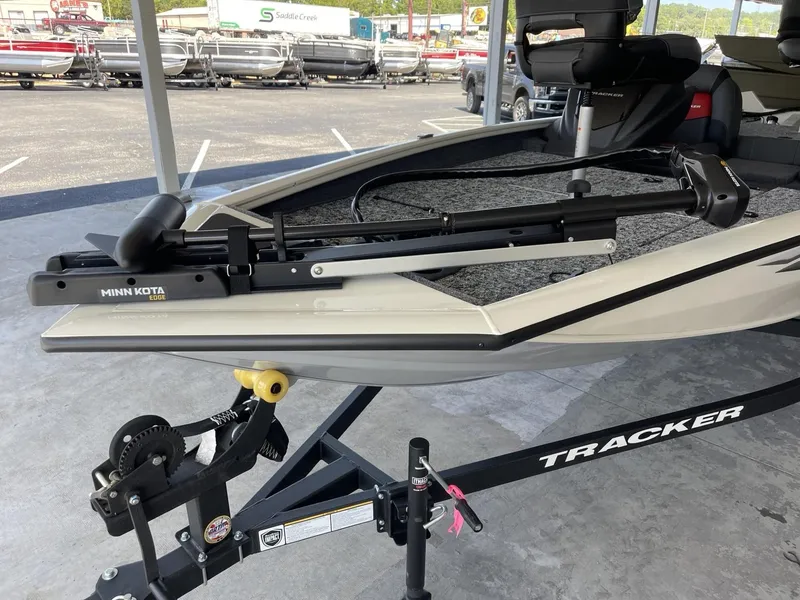 Slide: The Image of 2025 Tracker Pro Team 175 boat with Minn Kota trolling motor on trailer. - 7