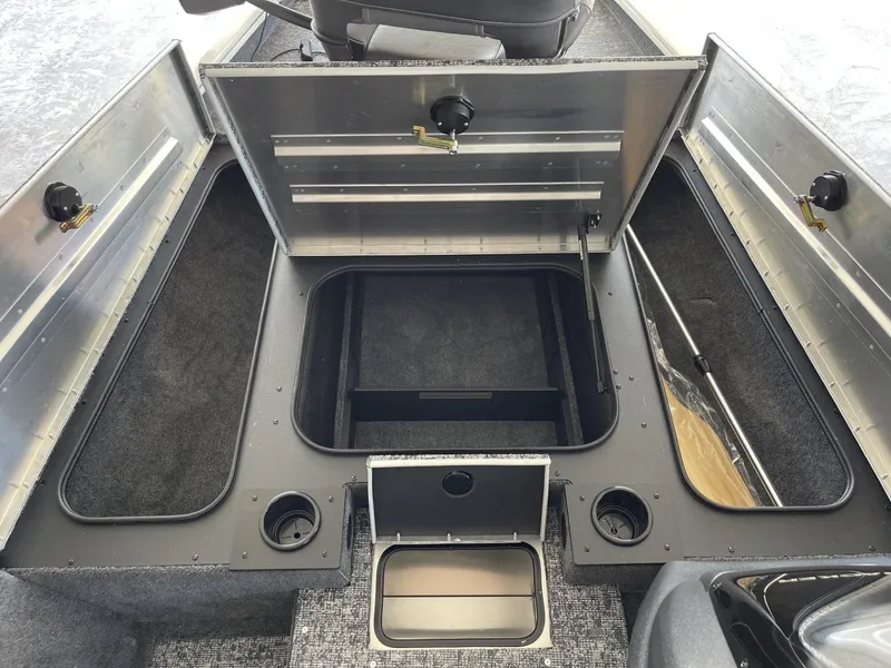 Slide: The Image of 2025 Tracker Pro Team 175 boat storage compartments and seating area. - 9