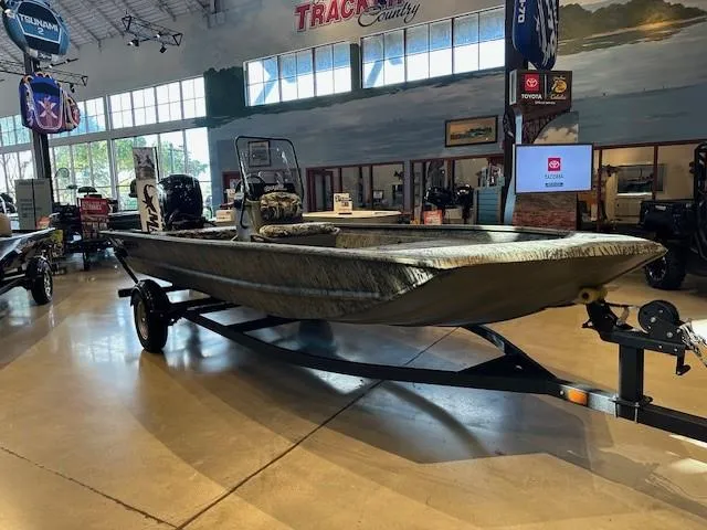 The Image of 2025 Tracker Grizzly 1860 CC boat displayed in showroom on trailer. - 0