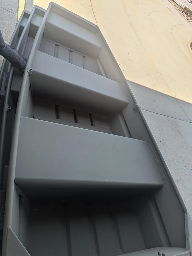 Slide: The Image of 2025 Tracker Grizzly 1036 Utility boat, interior view, gray finish. - 26