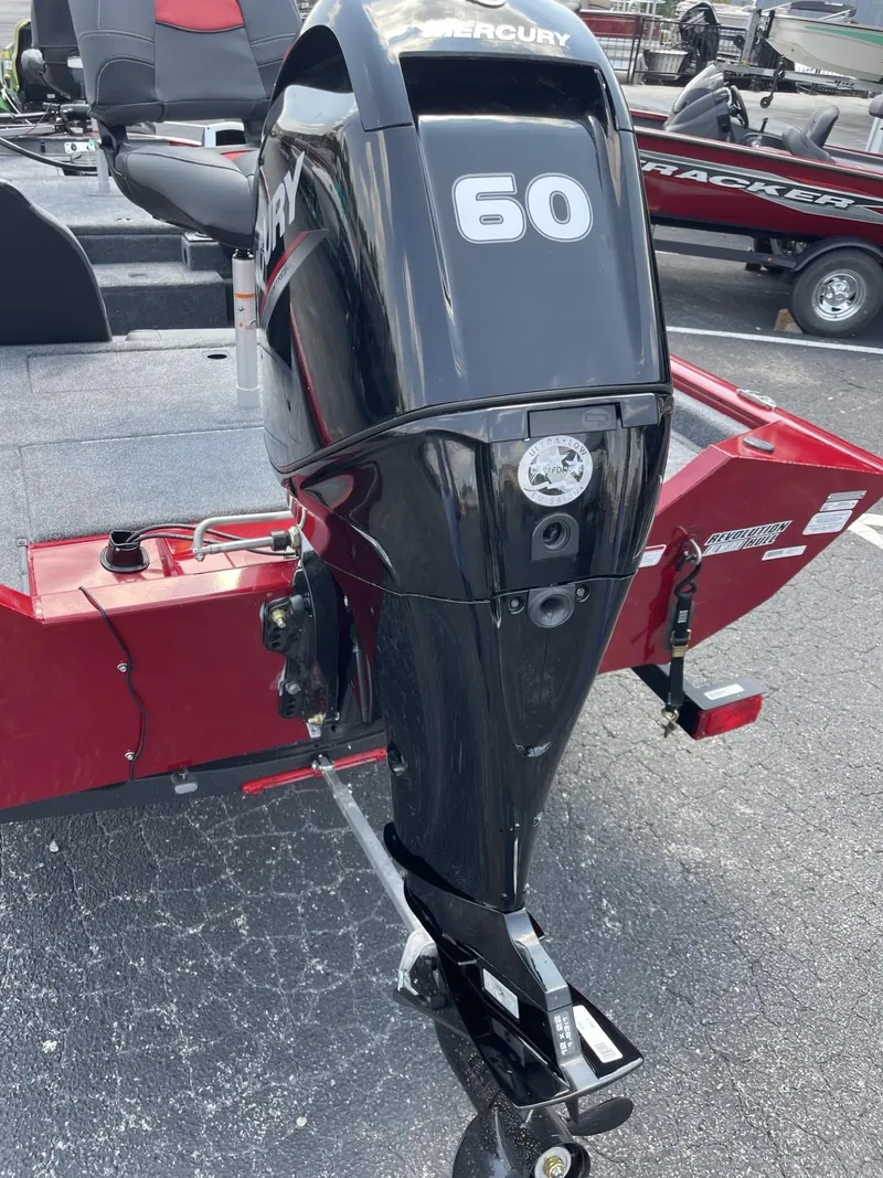 Slide: The Image of 2025 Tracker Pro Team 175 boat with Mercury 60 outboard motor, red and black design. - 3