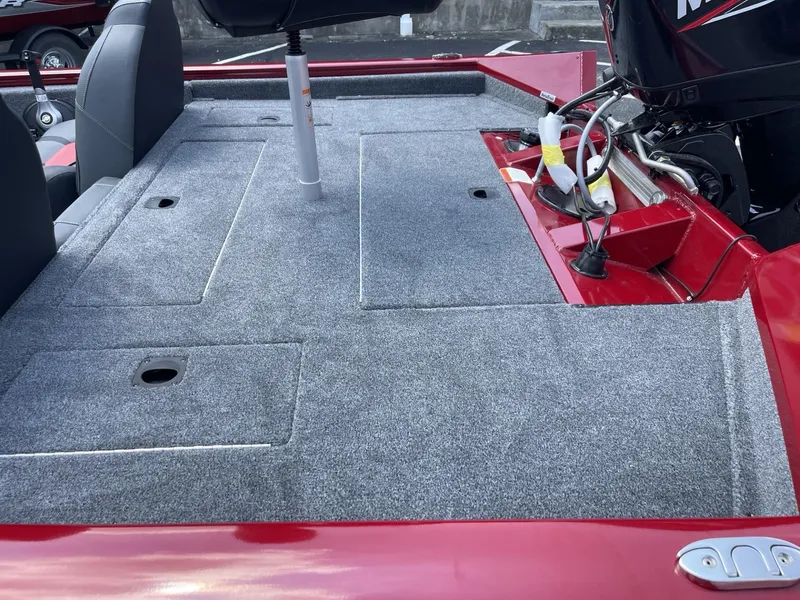 Slide: The Image of 2025 Tracker Pro Team 175 boat deck with gray carpet and red accents. - 4