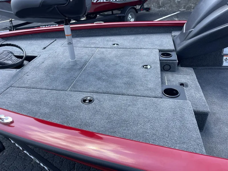 Slide: The Image of 2025 Tracker Pro Team 175 boat deck with seating and storage compartments. - 7