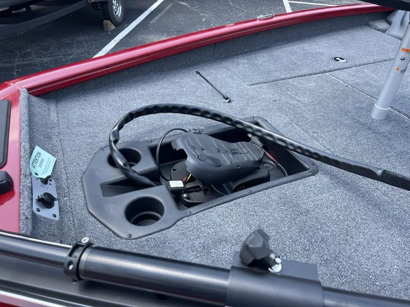 Slide: The Image of 2025 Tracker Pro Team 175 boat deck with trolling motor and carpeted surface. - 9