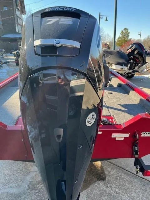 Slide: The Image of 2025 Tracker Pro Team 175 boat with Mercury 75 engine, displayed outdoors. - 2