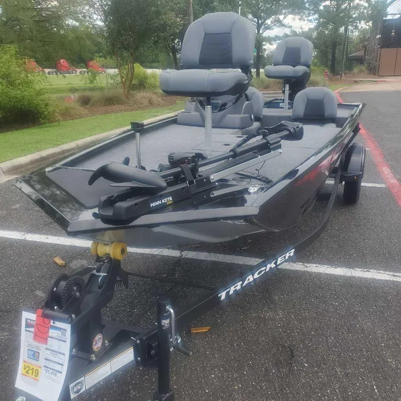 Slide: The Image of 2025 Tracker Pro 170 boat parked, featuring comfortable seating and a trolling motor. - 3