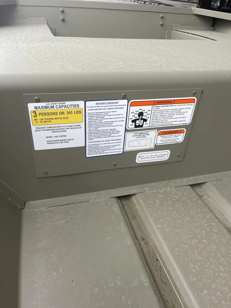 Slide: The Image of 2025 Tracker Grizzly 1436 Utility boat capacity label, showing maximum load and safety instructions. - 2