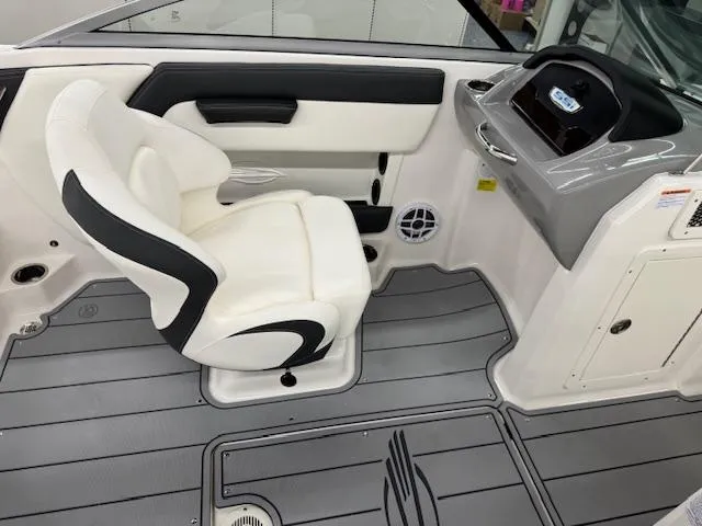 Slide: The Image of 2025 Chaparral 21 SSi Ski & Fish OB interior with white seating and gray flooring. - 10
