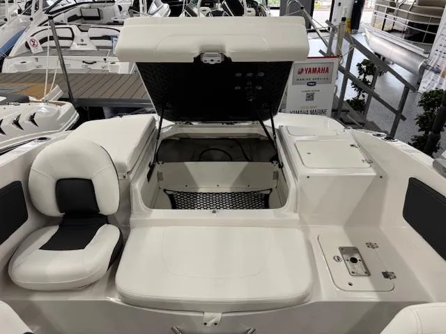 Slide: The Image of 2025 Chaparral 21 SSi Ski & Fish OB boat interior with open storage compartment. - 16