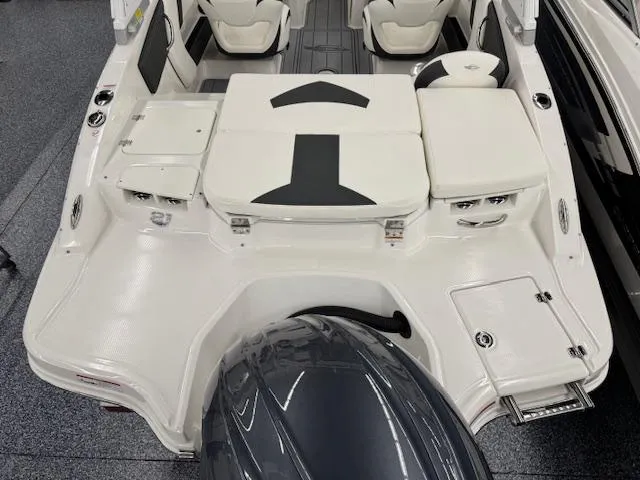 Slide: The Image of 2025 Chaparral 21 SSi Ski & Fish OB boat interior with seating and motor. - 19