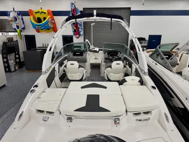 Slide: The Image of 2025 Chaparral 21 SSi Ski & Fish OB boat interior with seating and accessories. - 2