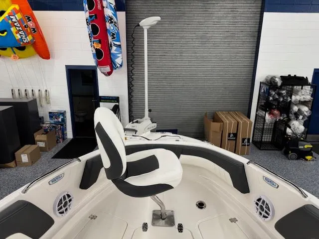 Slide: The Image of 2025 Chaparral 21 SSi Ski & Fish OB boat interior with seating and fishing equipment. - 3