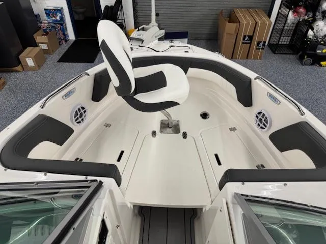 Slide: The Image of 2025 Chaparral 21 SSi Ski & Fish OB boat interior with seating and storage. - 4