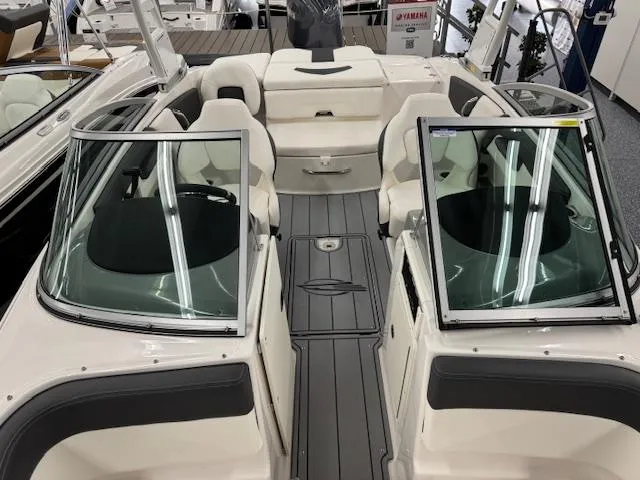 Slide: The Image of 2025 Chaparral 21 SSi Ski & Fish OB boat interior with seating and windshield. - 5