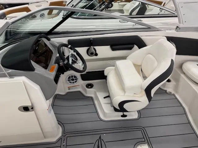Slide: The Image of 2025 Chaparral 21 SSi Ski & Fish OB interior with sleek design and comfortable seating. - 8