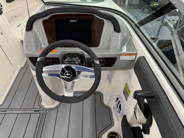 Slide: The Image of 2025 Chaparral 21 SSi Ski & Fish OB dashboard with steering wheel and controls. - 9