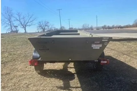 Slide: The Image of 2025 Tracker Grizzly 1036 Utility boat on trailer outdoors. - 3