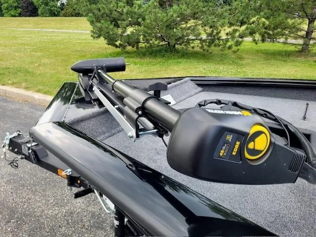 Slide: The Image of 2025 Tracker Pro Team 175 boat with trolling motor on grassy background. - 4