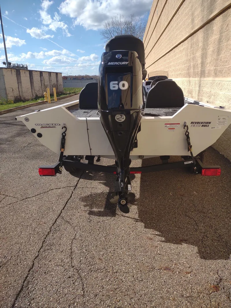 Slide: The Image of 2025 Tracker Pro Team 175 boat with Mercury 60 engine, parked outdoors. - 3