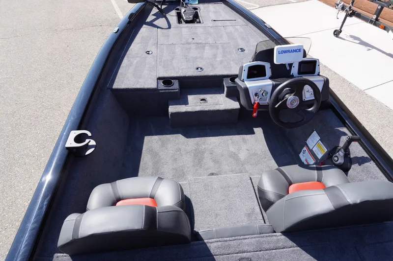 Slide: The Image of 2025 Tracker Pro Team 175 boat interior with steering wheel and seating. - 2