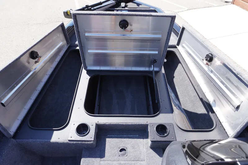 Slide: The Image of 2025 Tracker Pro Team 175 boat storage compartments open, showcasing spacious interior design. - 3