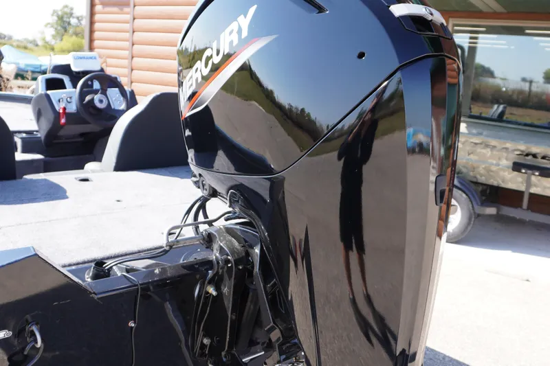 Slide: The Image of 2025 Tracker Pro Team 175 boat with Mercury outboard motor, featuring a sleek design. - 5