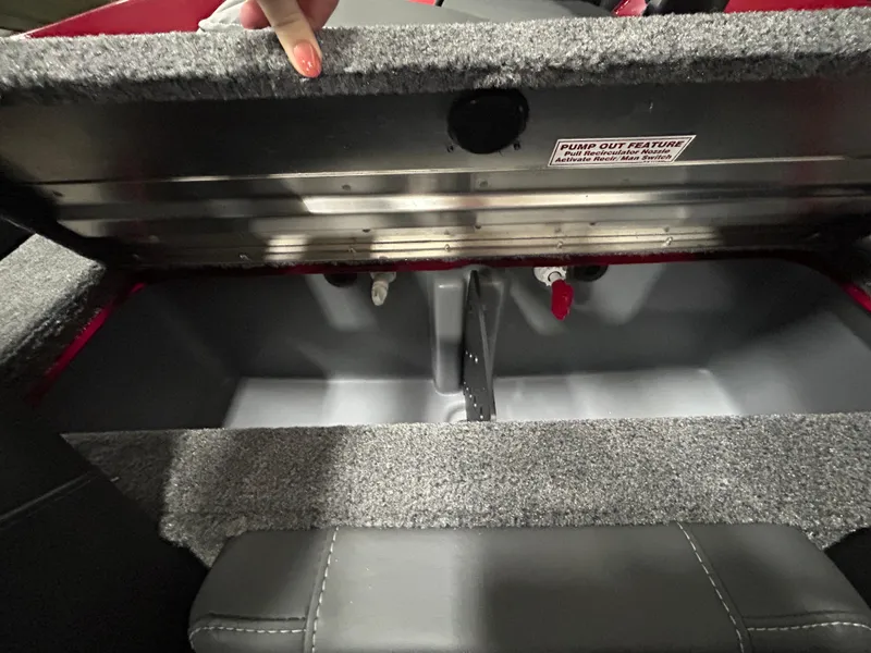 Slide: The Image of 2025 Tracker Pro Team 175 boat storage compartment with pump-out feature. - 12