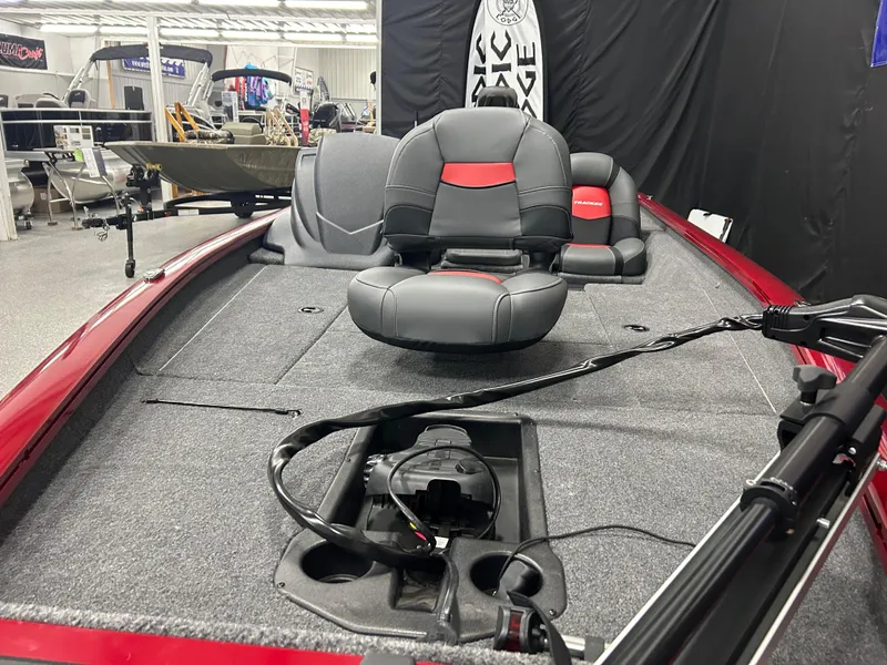 Slide: The Image of 2025 Tracker Pro Team 175 boat interior with seating and fishing equipment. - 6