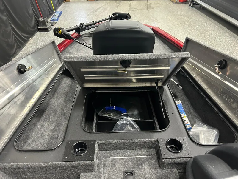 Slide: The Image of 2025 Tracker Pro Team 175 boat interior with open storage compartments. - 7