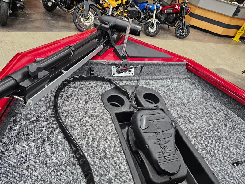 Slide: The Image of 2025 Tracker Pro Team 175 boat interior with trolling motor and carpeted deck. - 11