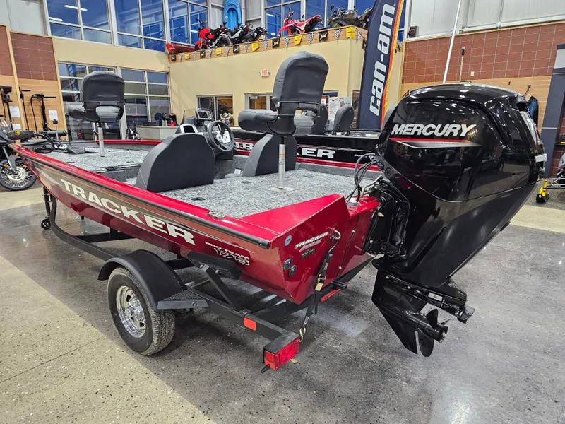 Slide: The Image of 2025 Tracker Pro Team 175 boat with Mercury engine in showroom. - 2