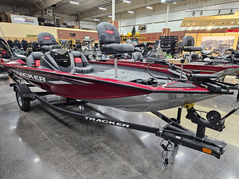 Slide: The Image of 2025 Tracker Pro Team 175 boat displayed in showroom, featuring sleek design and comfortable seating. - 4